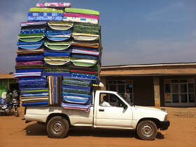 truck loaded with matresses