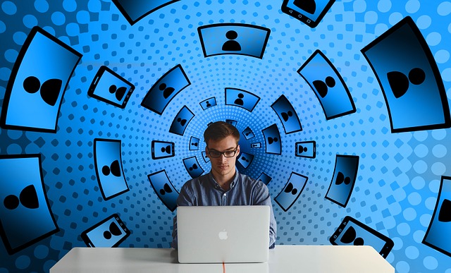 man on computer surrounded by screen tunnel