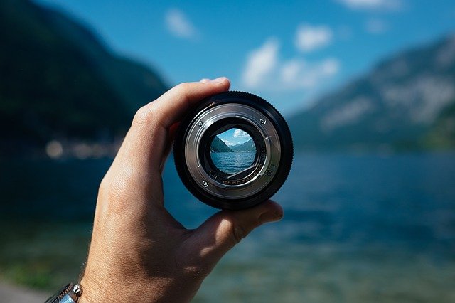 camera lens pointing to landscape